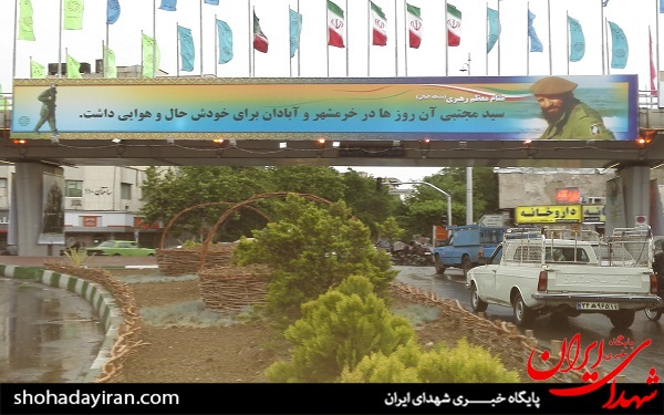 نصب عکس شهید هاشمی روی پل +عکس نصب عکس شهید هاشمی روی پل +عکس