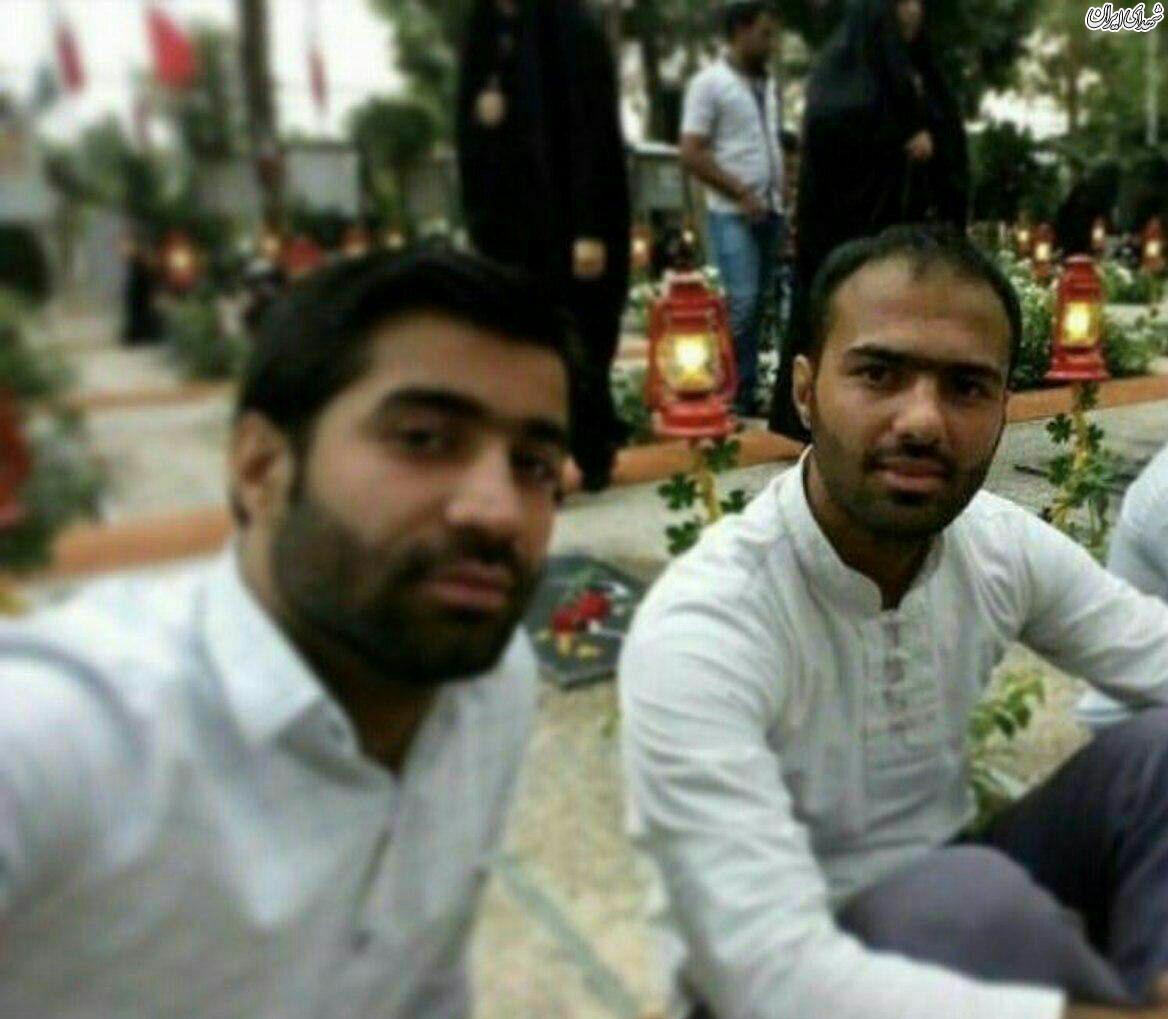 شهید آتش نشان در کنار مزار شهدا+عکس