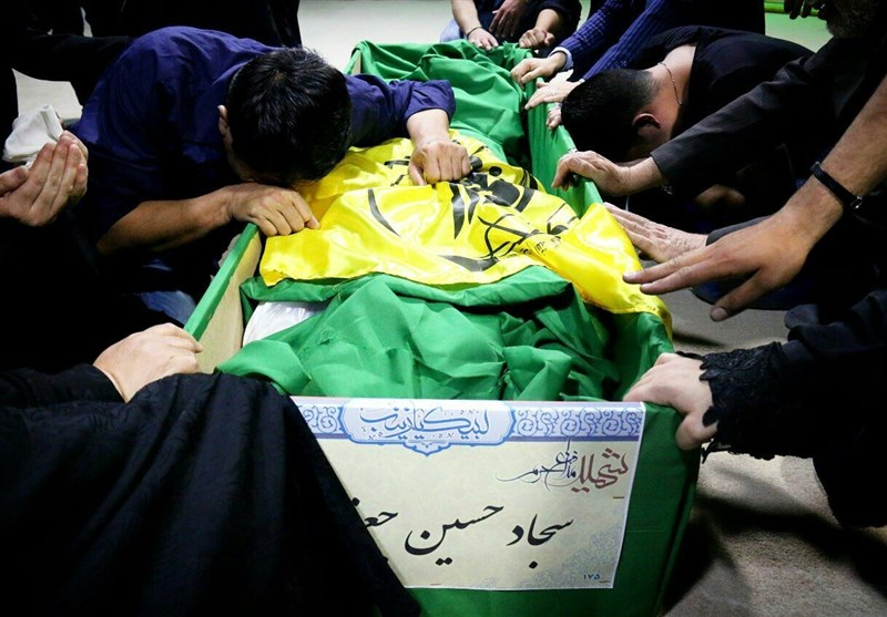 وداع با پیکر شهید فاطمیون در معراج شهدا+عکس وداع با پیکر شهید فاطمیون در معراج شهدا+عکس
