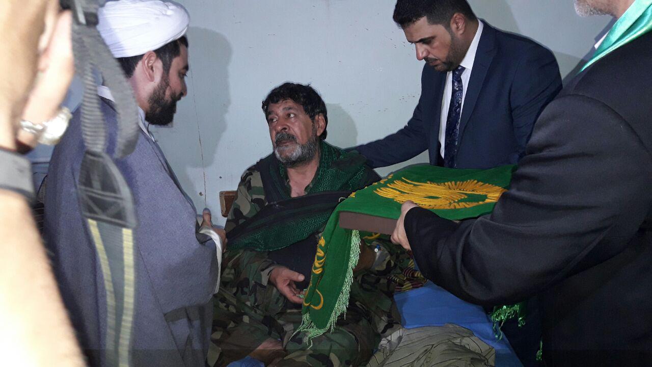 عیادت خدام امام رضا(ع) از جانبازان حشد الشعبی