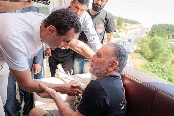 دیدار بشار اسد و همسرش با مجروحان و فرزندان شهدا دیدار بشار اسد و همسرش با مجروحان و فرزندان شهدا
